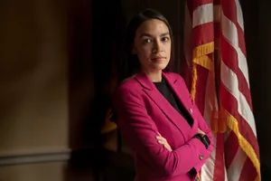 Alexandria Ocasio-cortez Folds Arms By American Flag Wallpaper