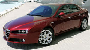 Alfa Romeo 159 Luxury Sports Sedan Driving On Road Wallpaper