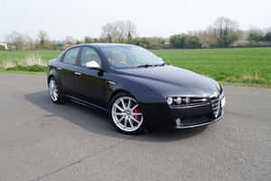 Alfa Romeo 159 On A Scenic Road Wallpaper