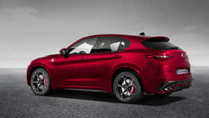 Alfa Romeo Stelvio Carving A Path On The Open Road Wallpaper