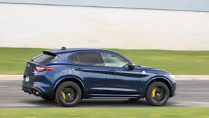Alfa Romeo Stelvio Cruising Along The Scenic Highway Wallpaper