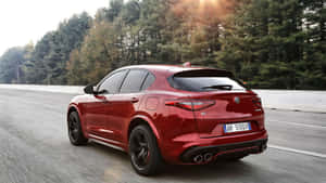 Alfa Romeo Stelvio On A Scenic Road Wallpaper