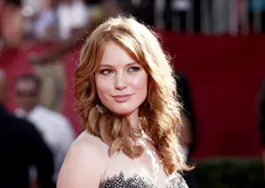 Alicia Witt Posing Elegantly For A Photoshoot Wallpaper