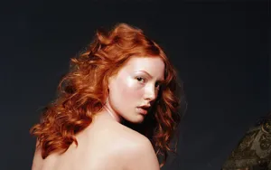 Alicia Witt Posing In A Stunning Red Dress Wallpaper