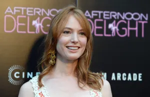 Alicia Witt Posing In A White Dress Wallpaper