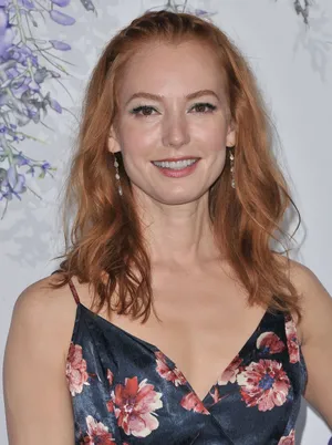 Alicia Witt Striking A Pose In A Glamorous Outfit. Wallpaper