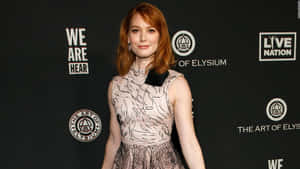 Alicia Witt Striking Pose At A Photoshoot Wallpaper