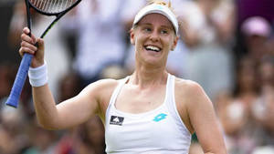 Alison Riske-amritraj Smiling With Raised Racket Wallpaper