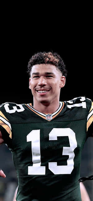 Allen Lazard Smilingin Green Bay Packers Uniform Wallpaper