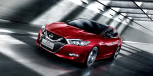 Alluring Nissan Maxima In Radiant Lighting Wallpaper