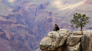 Alone Boy On A Cliff Wallpaper