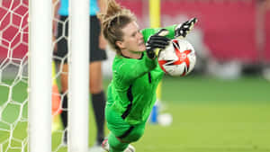 Alyssa Naeher In Action During A Soccer Match Wallpaper