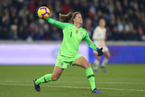 Alyssa Naeher In Action On The Soccer Field Wallpaper