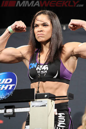 Amanda Nunes Flex On Stage Wallpaper