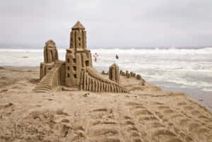 Amazing Sandcastle Masterpiece On A Sunny Beach Wallpaper