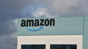 Amazon Uk Logo On Light Teal Building Wallpaper