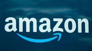 Amazon Uk's Iconic Logo Featuring A Blue Arrow Wallpaper