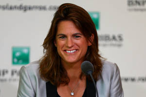 Amélie Mauresmo At A Press Conference Wallpaper