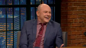 American Actor And Comedian Rob Corddry Posing Against A Colorfully Painted Wall. Wallpaper