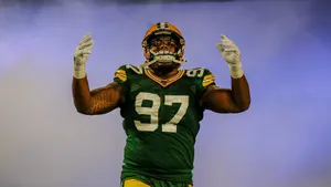 American Football Defensive Tackle Kenny Clark On Smoke Wallpaper