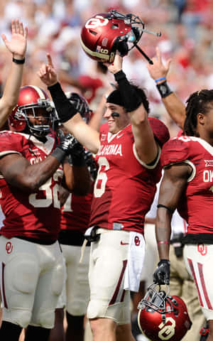 American Football Quarterback Baker Mayfield Stands With A Determined Expression On The Field Wallpaper