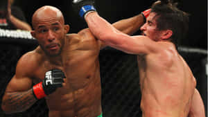 American Mma Fighter - Demetrious Johnson In Action Against Joseph Benavidez Wallpaper