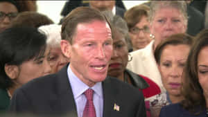 American Politician Richard Blumenthal Surrounded By People Wallpaper