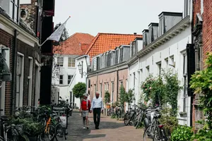 Amersfoort Historic Cityscape With Couple Walking Wallpaper