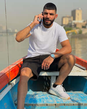 Amir Albazi Calling On Boat Wallpaper