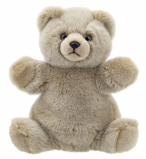 An Adorable Cuddly Teddy Bear Sitting On A Shelf Wallpaper