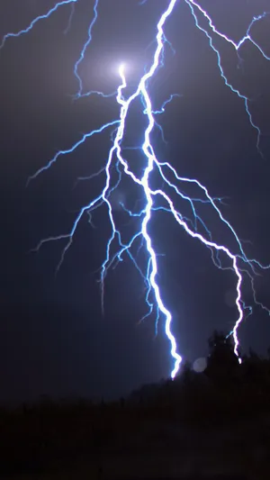 An Aesthetic Tale Of Lightning Across Skies Wallpaper