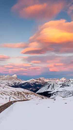 An Aesthetic Winter Phone Perched Atop A Snowy Outdoor Scene Wallpaper