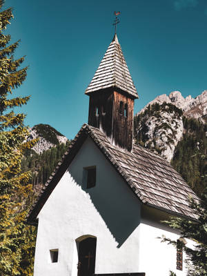 An Antique White Church In The Countryside Wallpaper