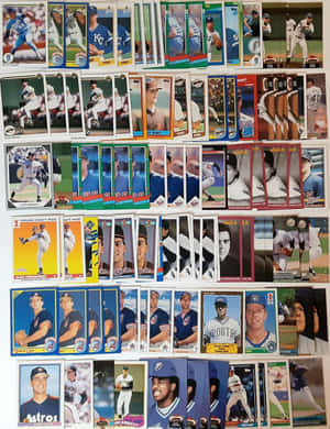 An Assortment Of Vintage Baseball Cards Featuring Iconic Players Wallpaper