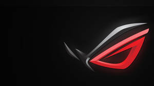 An Asus Rog Gaming Laptop, Featuring An Illuminated Red Eye Logo Wallpaper