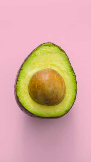 An Avocado On A Pink Background Wallpaper