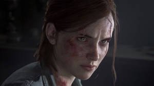 An Emotional Moment Of Ellie Being Wounded In The Iconic Game, The Last Of Us Wallpaper