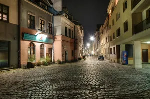 An Empty Street In Krakow, Poland At Night Wallpaper