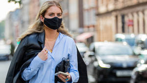 An Environmental Health Worker In Protective Gear During Coronavirus Outbreak Wallpaper