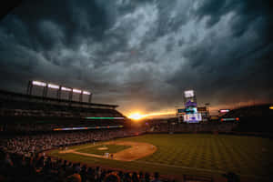 An Exciting Match At A Packed Baseball Stadium Wallpaper