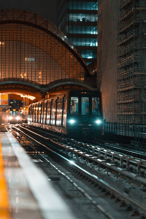 An Expansive View Of A City Railway Station Wallpaper