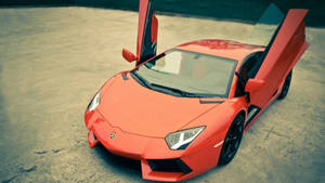 An Iconic Lamborghini Supercar With Scissor Doors Wallpaper