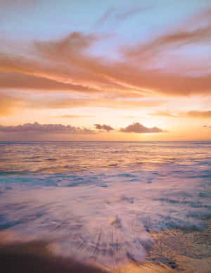 An Idyllic Beach Sky Balances The Blues And Creams Of A Peaceful Day Wallpaper