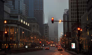 An Illuminated City Street In The Evening Wallpaper