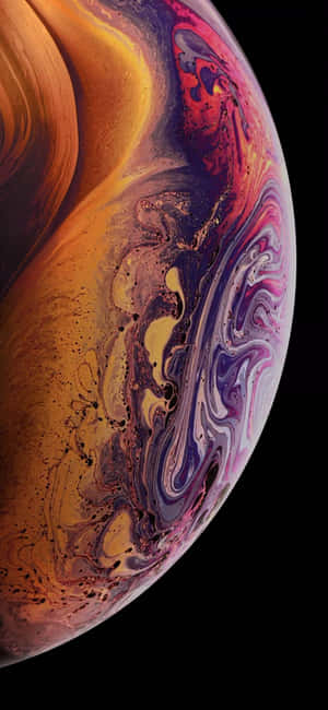 An Image Of An Apple Iphone Xs With A Colorful Swirl Wallpaper