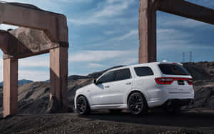 An Impressive View Of A Dodge Durango In A Picturesque Landscape. Wallpaper