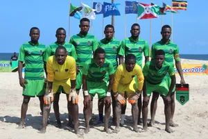 An Intensive Beach Soccer Match At Sunset Wallpaper