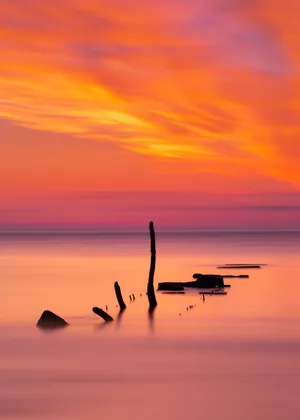 An Ocean Sunset With Endless Horizons Wallpaper