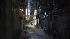 An Old City Pathway Illuminated In The Night. Wallpaper