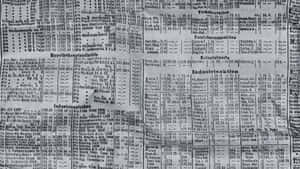 An Open Broadsheet Newspaper Showing Black And White Print Wallpaper